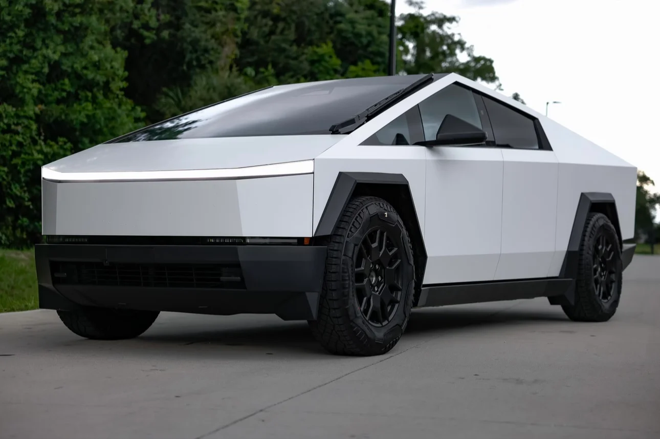 Full side view of a Tesla Cybertruck featuring a clean satin white car wrap, demonstrating custom vehicle finishes by Allure Auto Spa in Casselberry, Florida