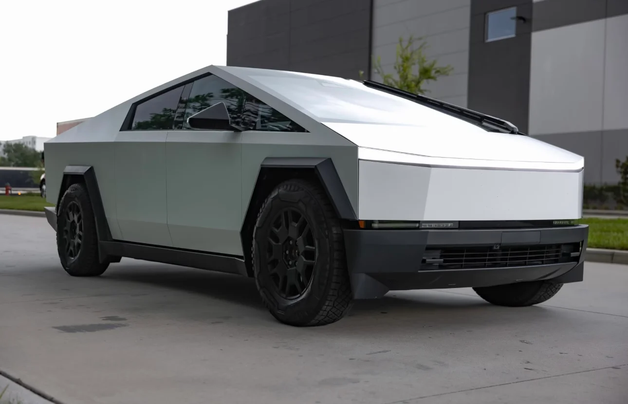 Tesla Cybertruck showcasing a custom light grey car wrap, professionally installed by Allure Auto Spa