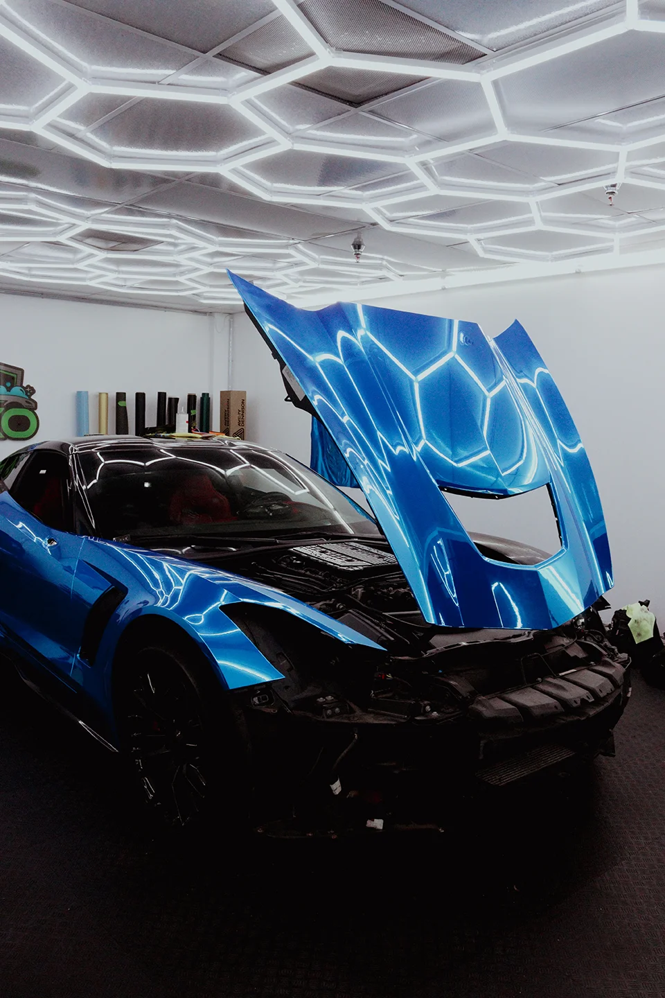 A finished Chevrolet Corvette C7 Z06 with a dazzling blue metallic car wrap, showcasing the custom work at Allure Auto Spa