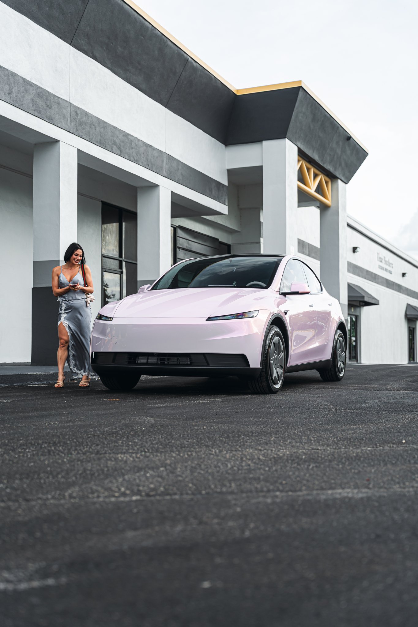 Tesla Model Y with a custom pink color-change wrap by Allure Auto Spa