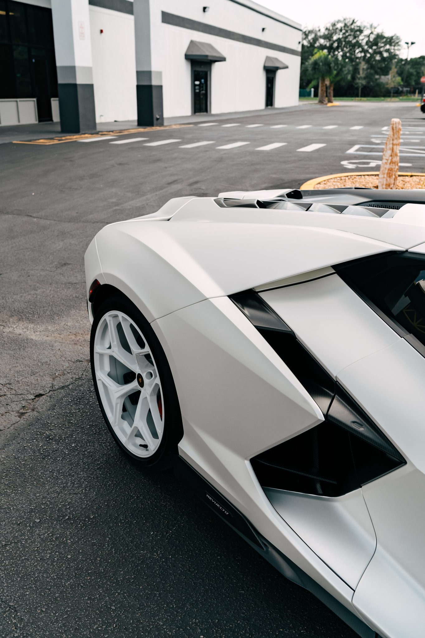 White Lamborghini Revuelto with full-body PPF, custom wrap, tint and ceramic by Allure Auto Spa in Fern Park, FL