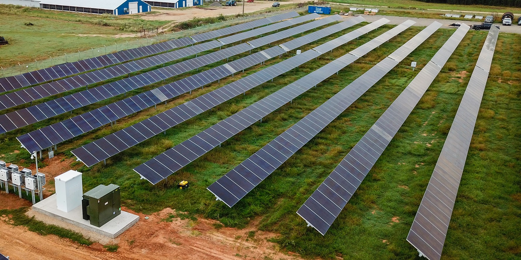 Wide shot of padmount transformer at solar farm project