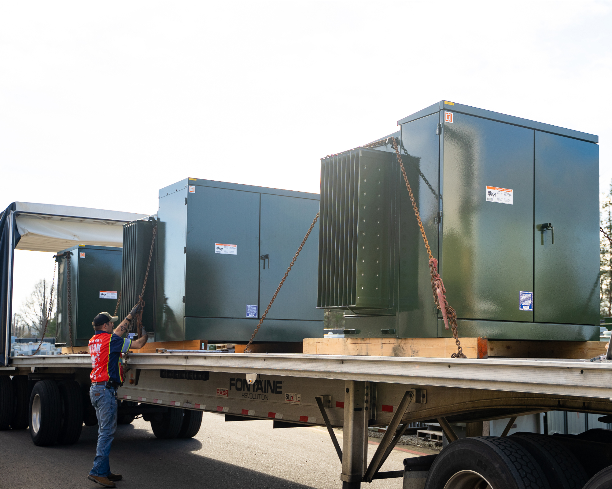 Loading padmount transformers onto truck for shipping