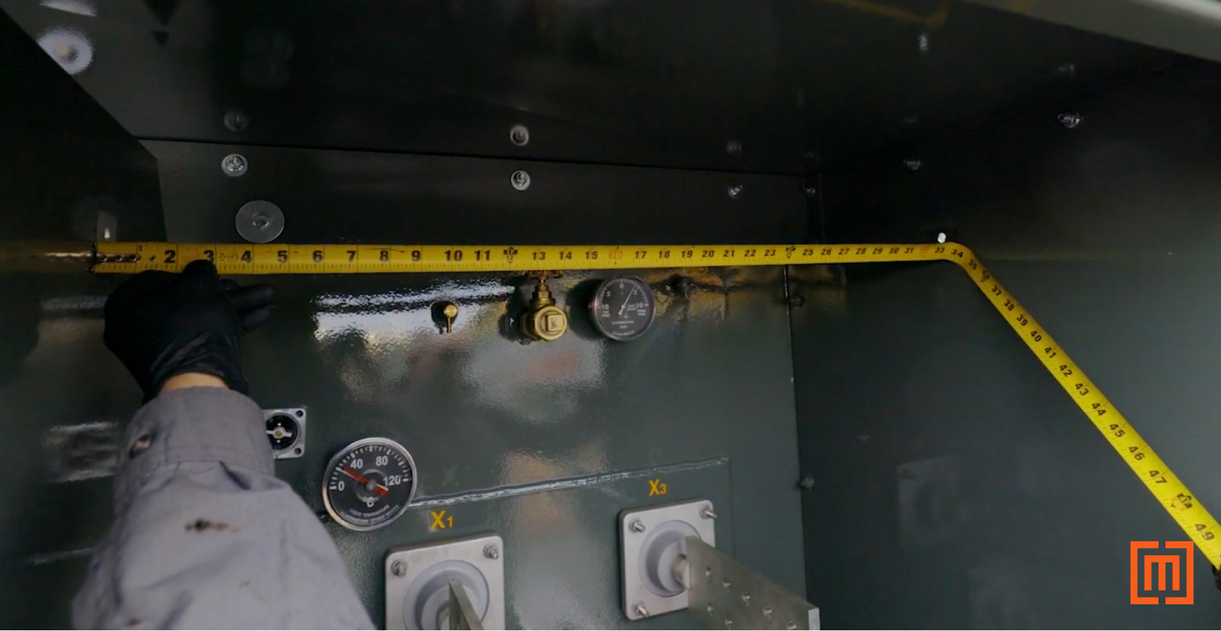 Measuring padmount cabinet with tape measure