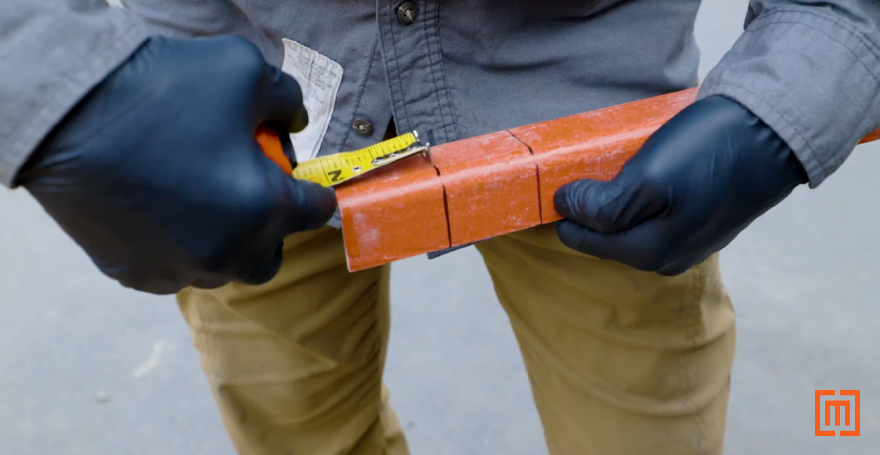 Measuring two inches on a piece of glastic