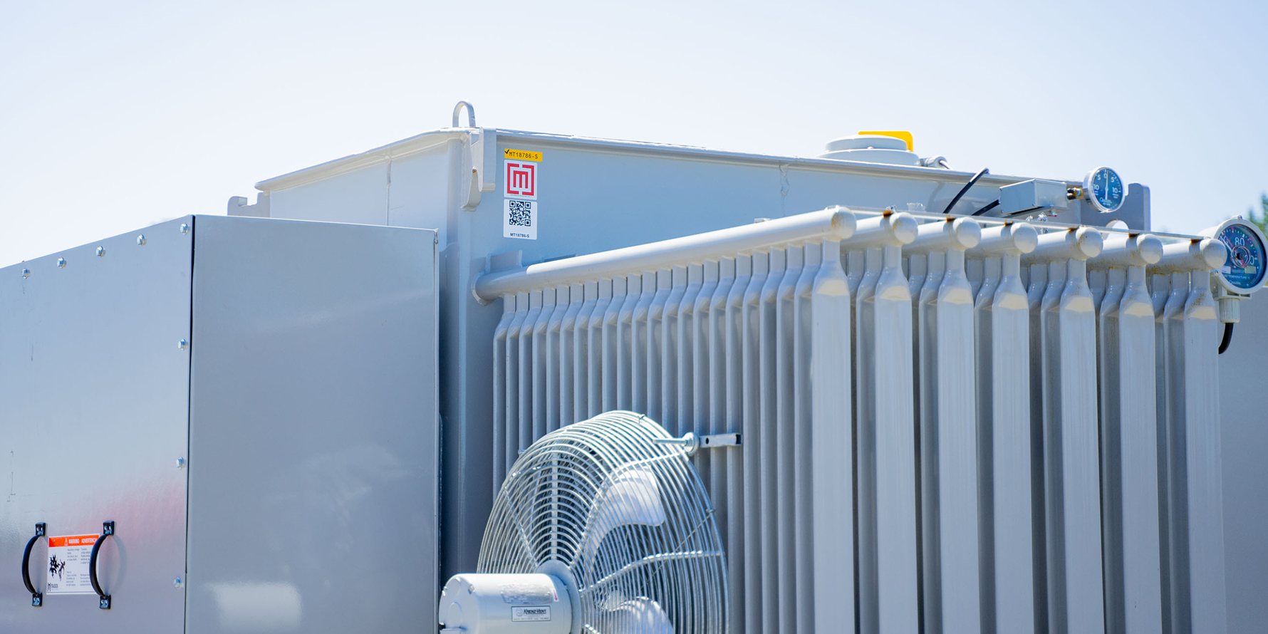 substation transformer with cooling fans in yard 
