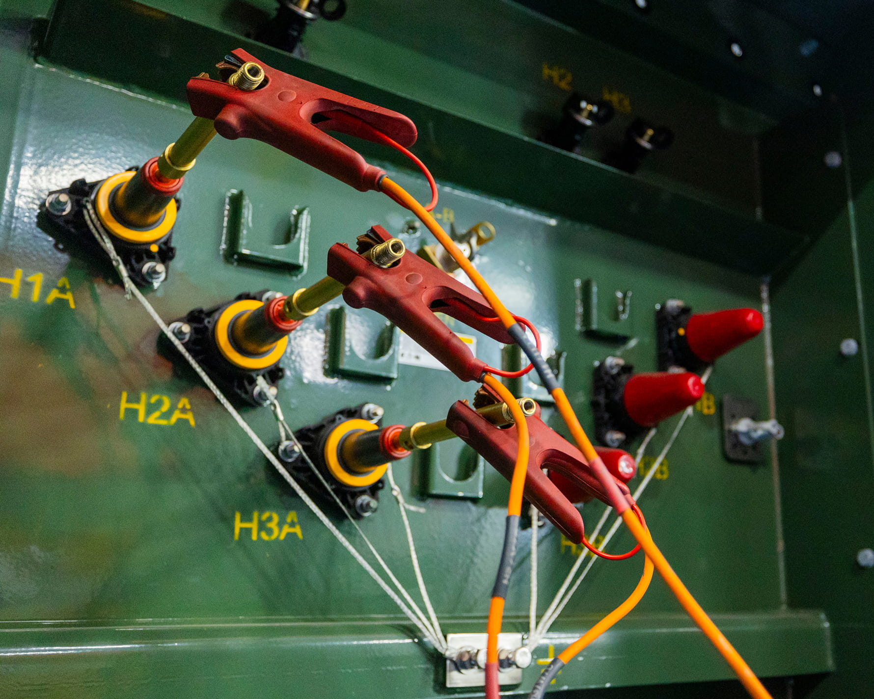 Green liquid filled padmounted transformer roped off for testing