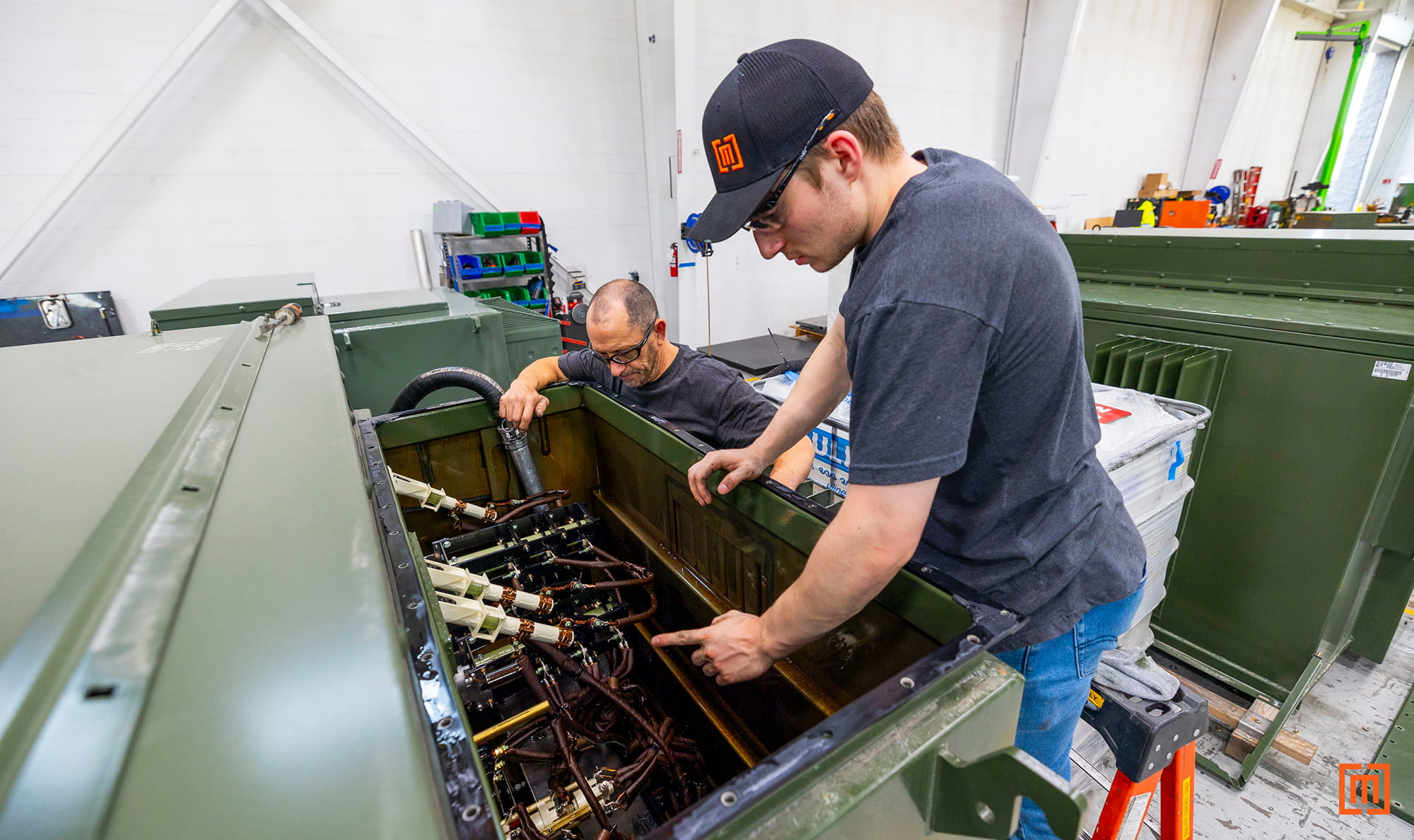 Maddox transformer techs inspecting core and coils in padmount transformer