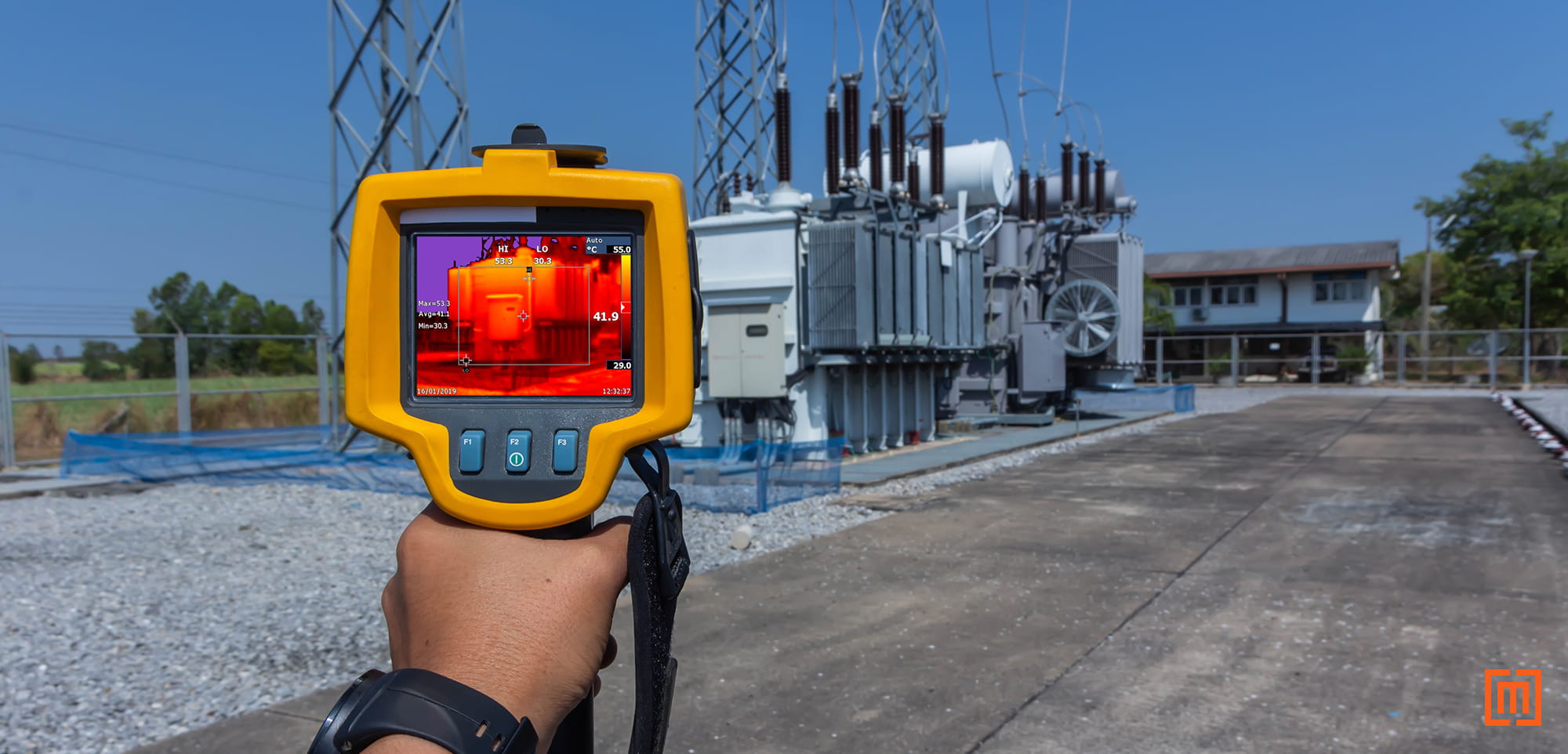 photo of heat gun being used to inspect a substation