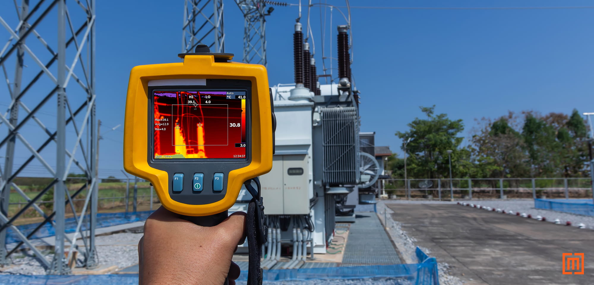 photo of thermal imaging device being used on a substation