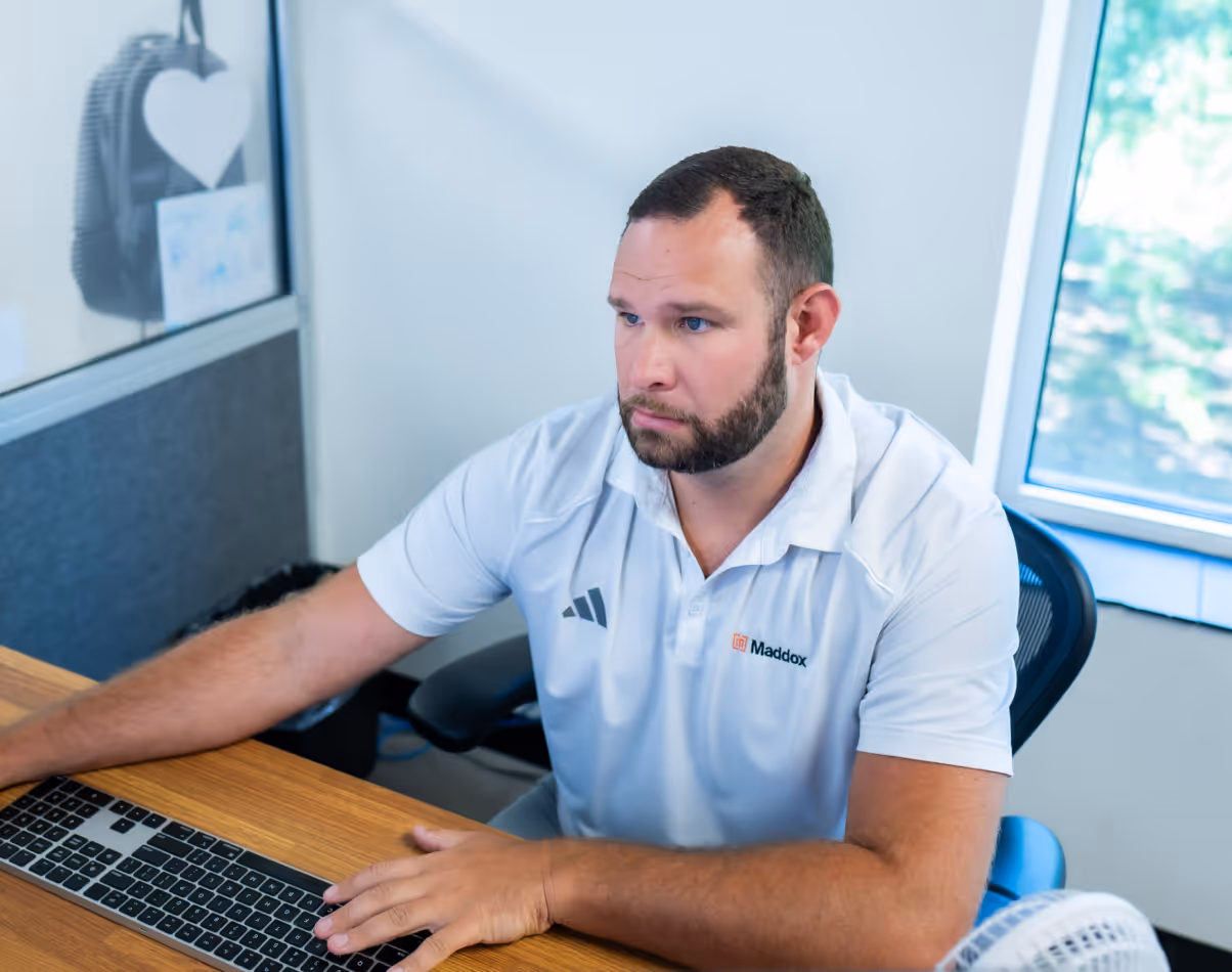 Maddox Transformer employee at his desk in Greer, SC