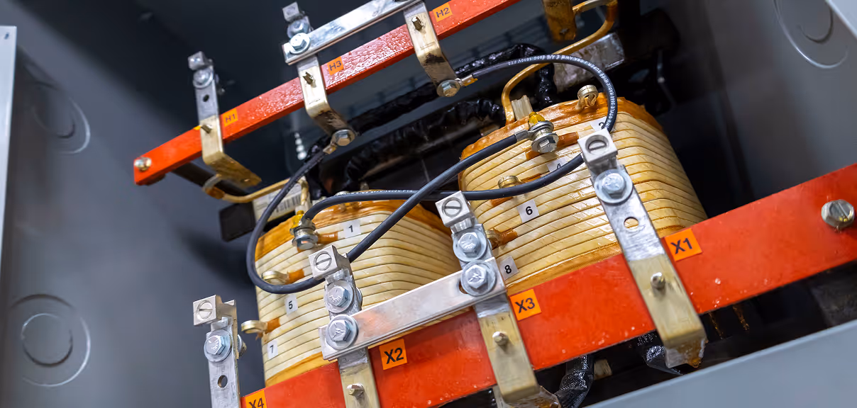 The core and coil of a single phase transformer.