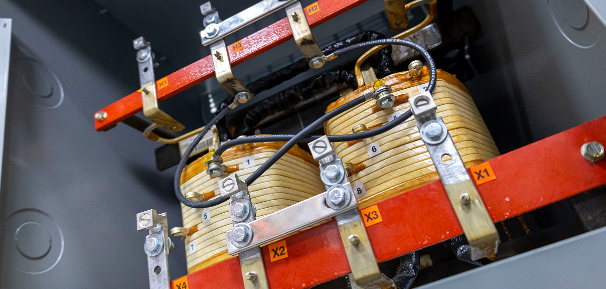The core and coil of a single phase transformer.
