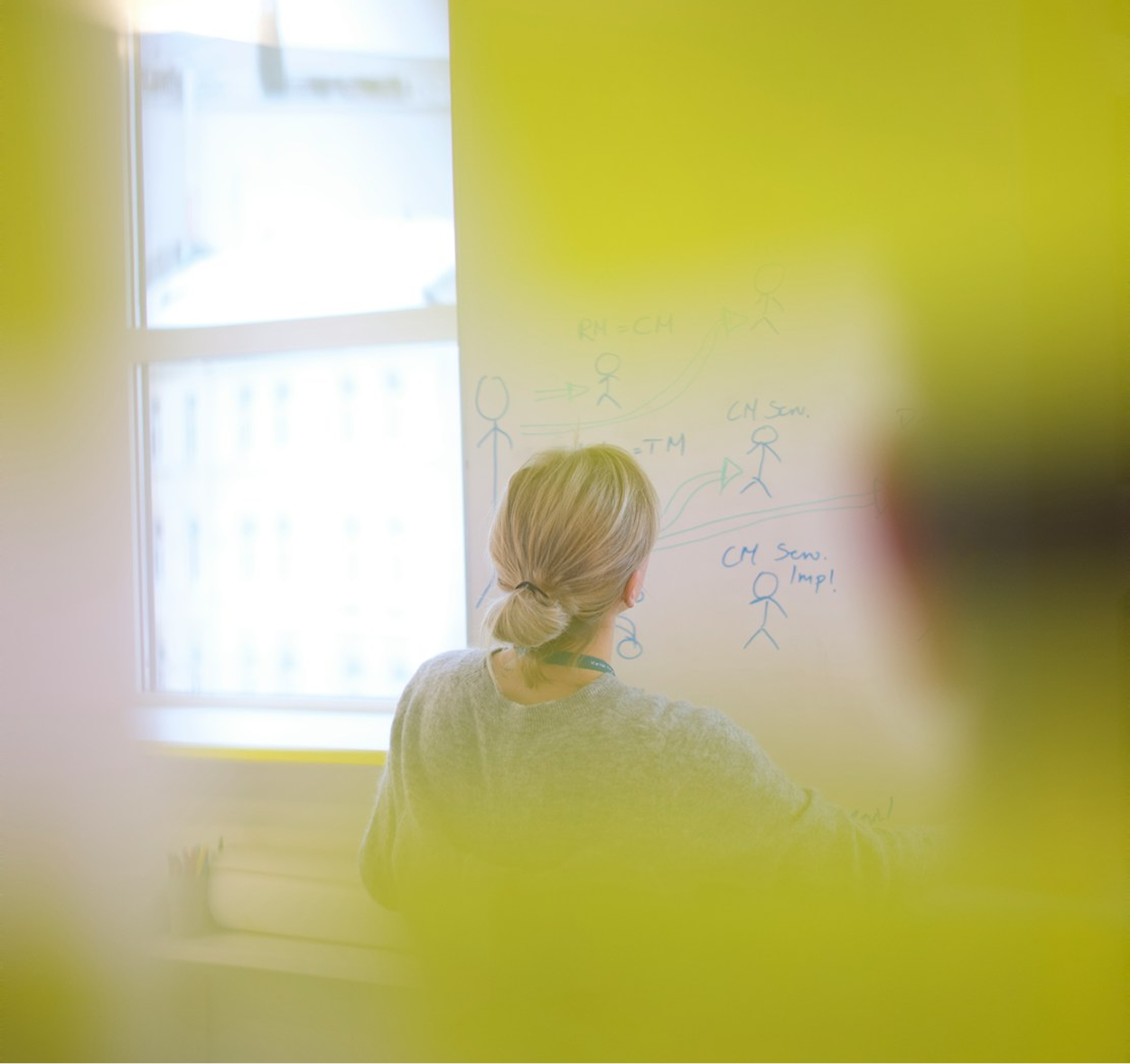 People playing Mario Kart at an arcade