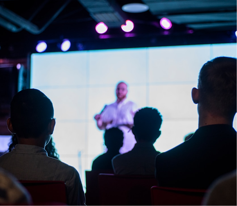 A group of people on a patio raising a glass