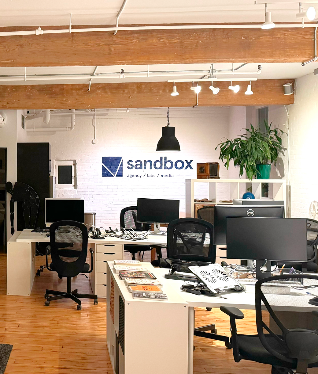 People playing Mario Kart at an arcade