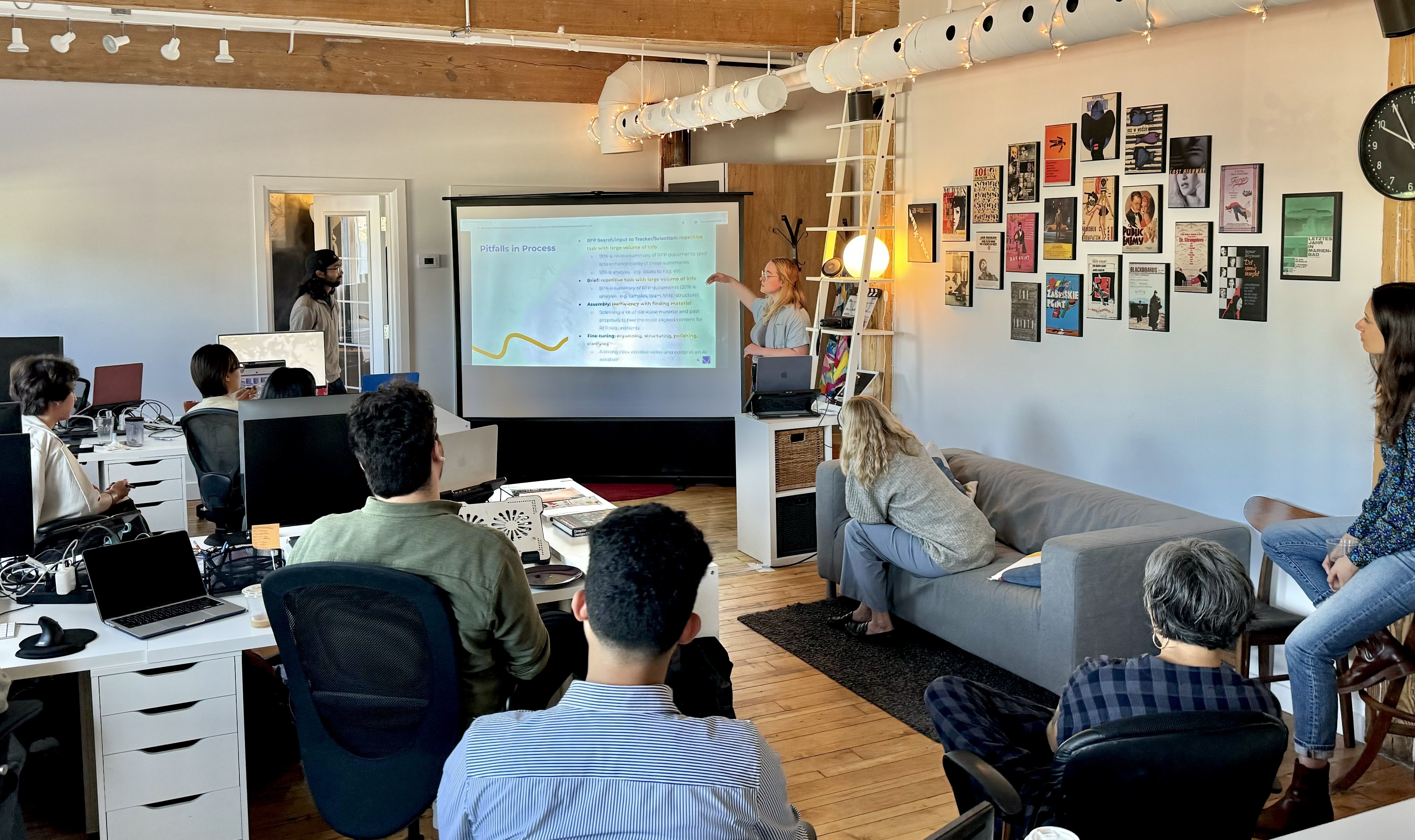 Two coworkers look at a whiteboard