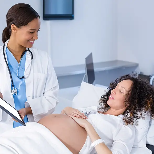 Pregnant woman at prenatal check-up in an affordable Los Angeles clinic