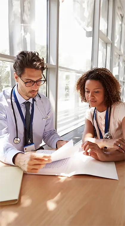 LA healthcare professionals discuss affordable family services in a modern office