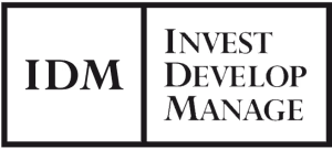 Logo with the letters IDM and the words Invest Develop Manage in a black square design.
