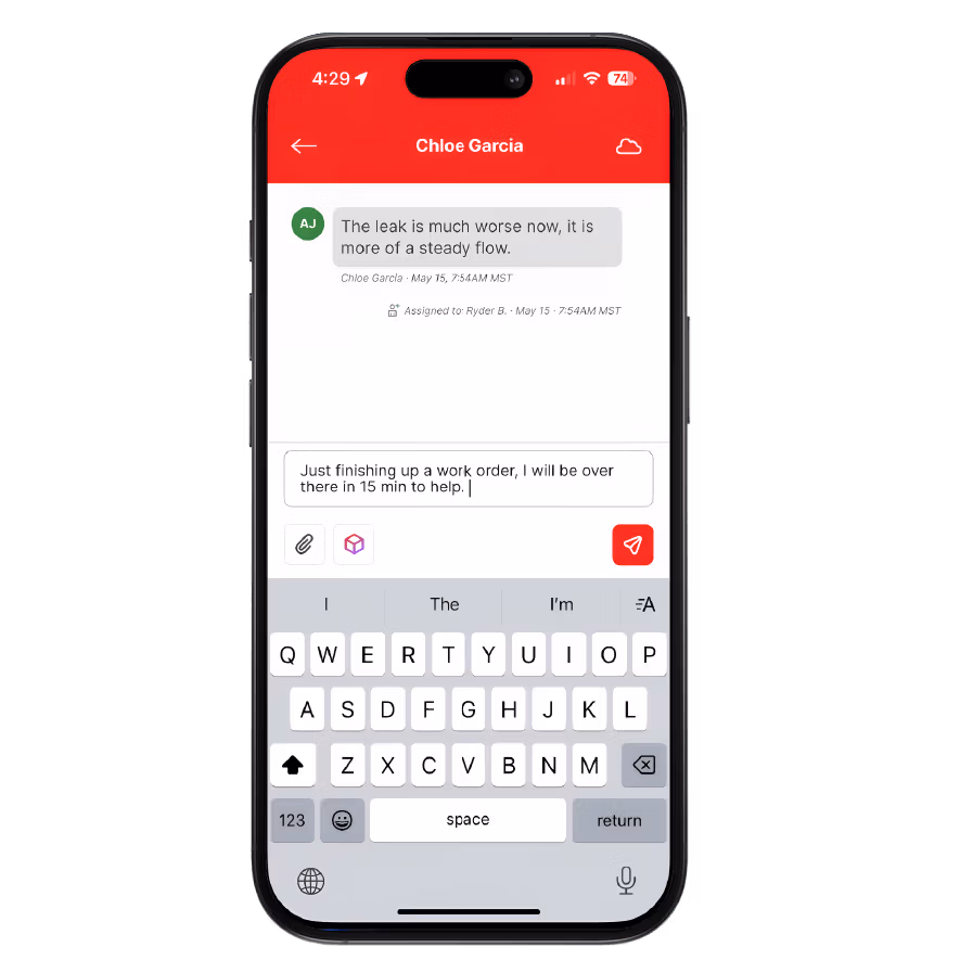 Smartphone screen showing a messaging app with a conversation from Chloe Garcia about a worsening leak, and a typed reply stating arrival in 15 minutes to help.