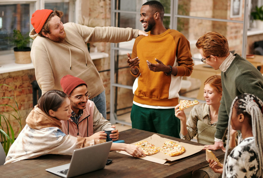 Group of young adults laughing together outside an apartment