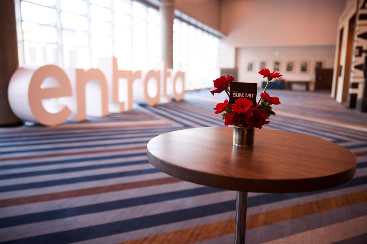 Picture of flowers on a table with a tag that says "Summit"