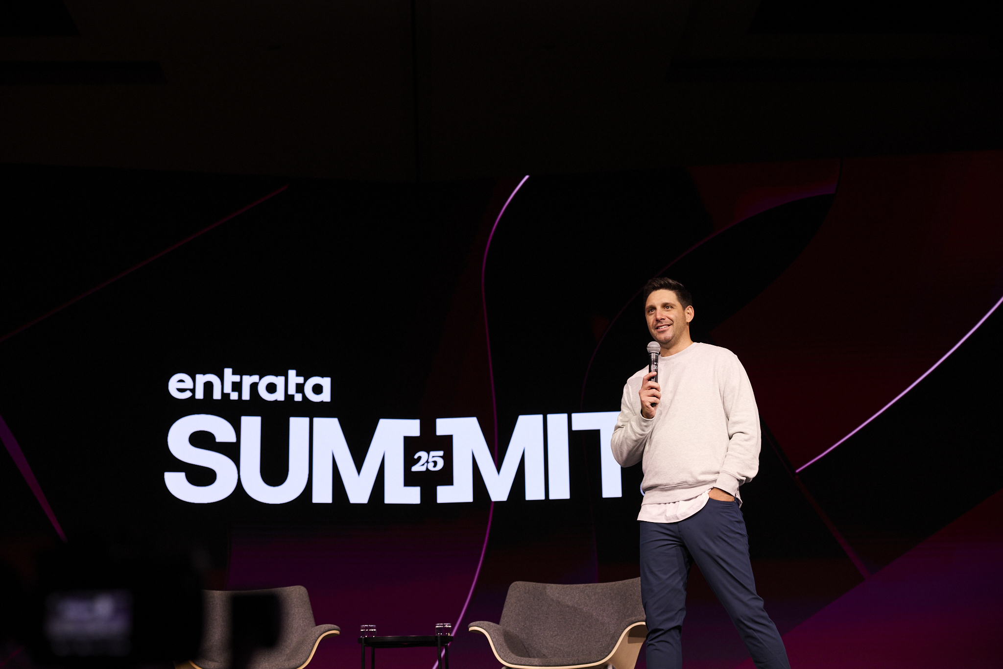 The Summit stage with a man with a microphone standing on it.