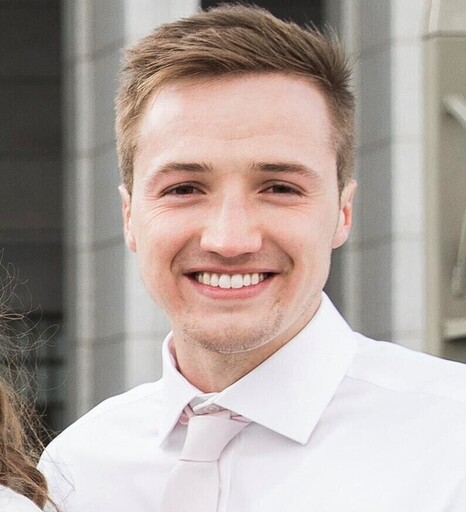 Man with a handsome smile in a shirt and tie