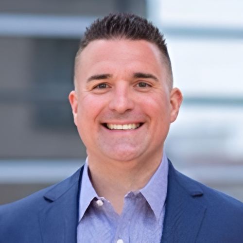 Jason Fort in a suit and tie, professional look