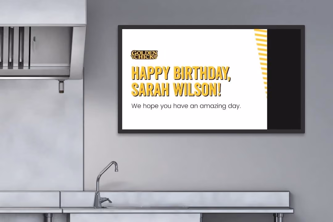 A kitchen adorned with a cheerful sign reading "Happy Birthday Sarah Wilson," creating a festive atmosphere.