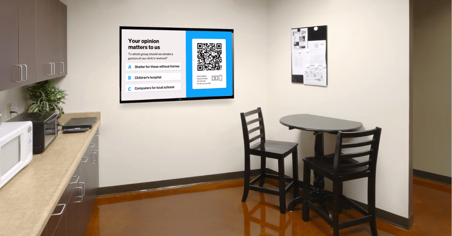 A kitchen featuring a table and chairs, with a wall displaying a decorative sign in the background.
