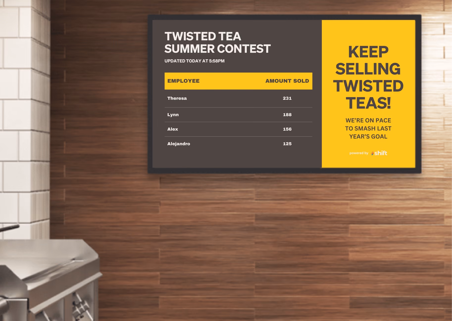 A wall sign displaying the text "Twisted Tea Summer Contest" in vibrant colors, inviting participation in the event.