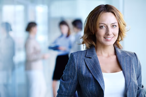 A woman in a suit standing