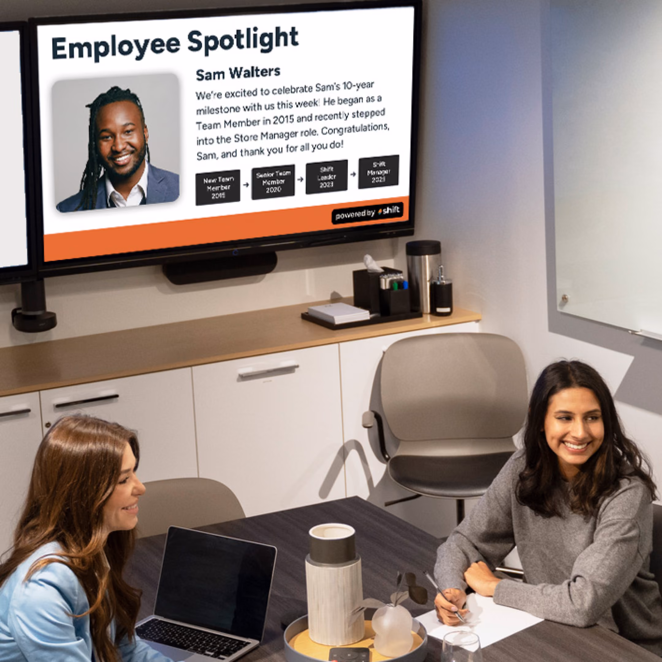 People working in a bright, modern office.
