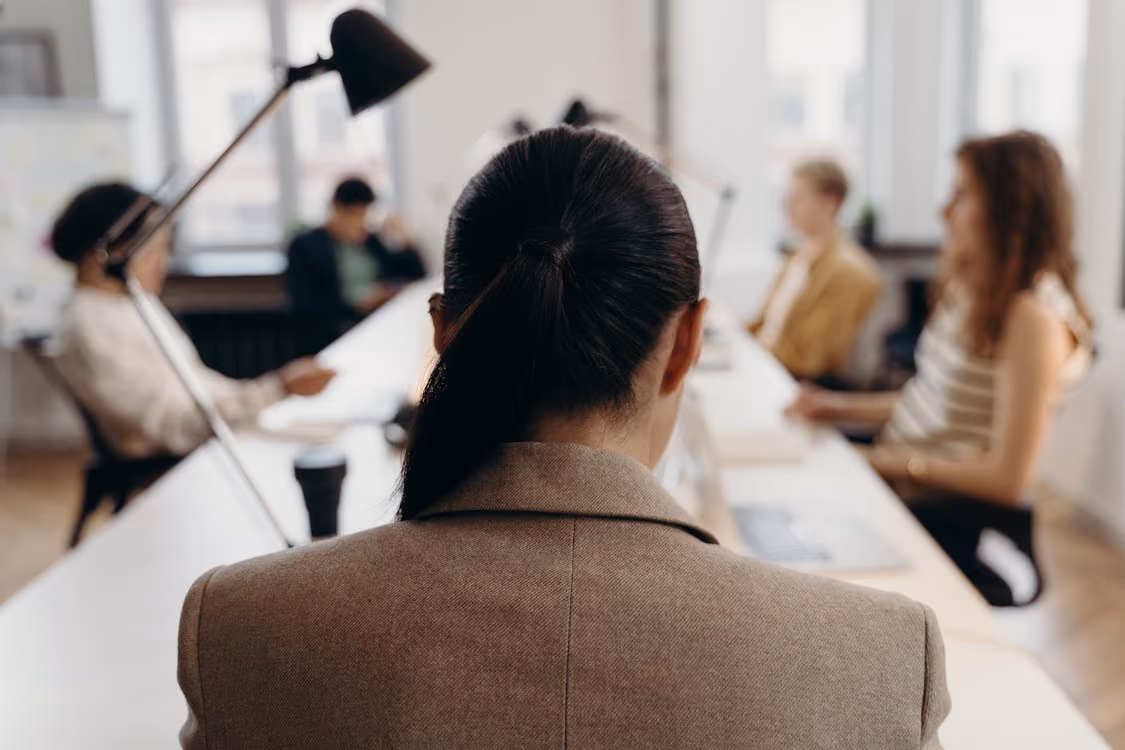 Woman sitting back in her office