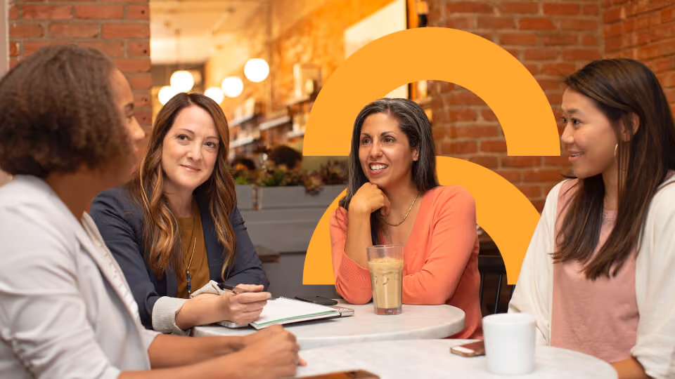 4 Women sitting around a table