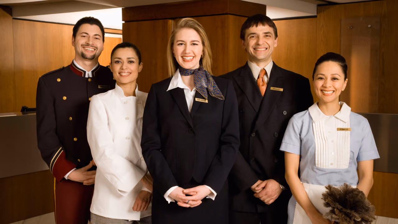 5 people standing in a hotel