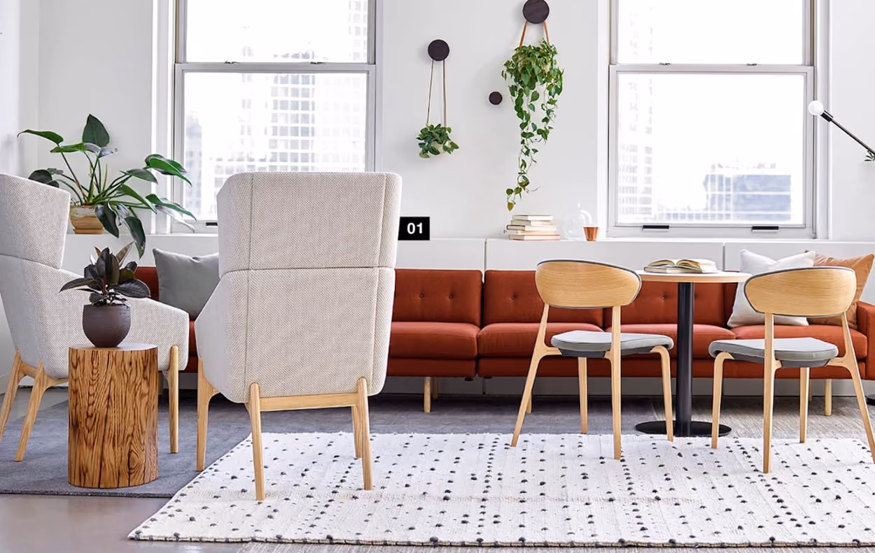 A cozy living room featuring a couch, a chair, and a table arranged for comfort and relaxation.
