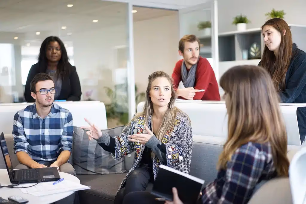 6 people sitting around having a discussion
