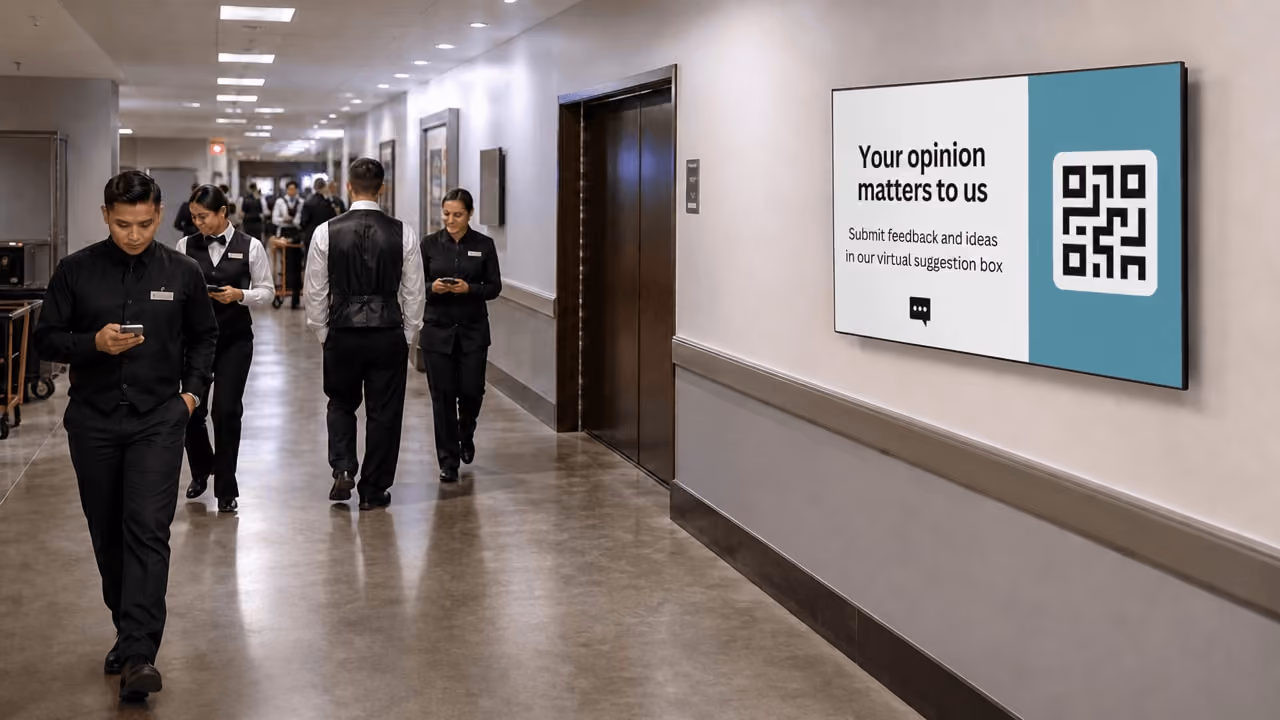 A diverse group of people walking together down a hallway, with a visible QR code on the wall beside them. 