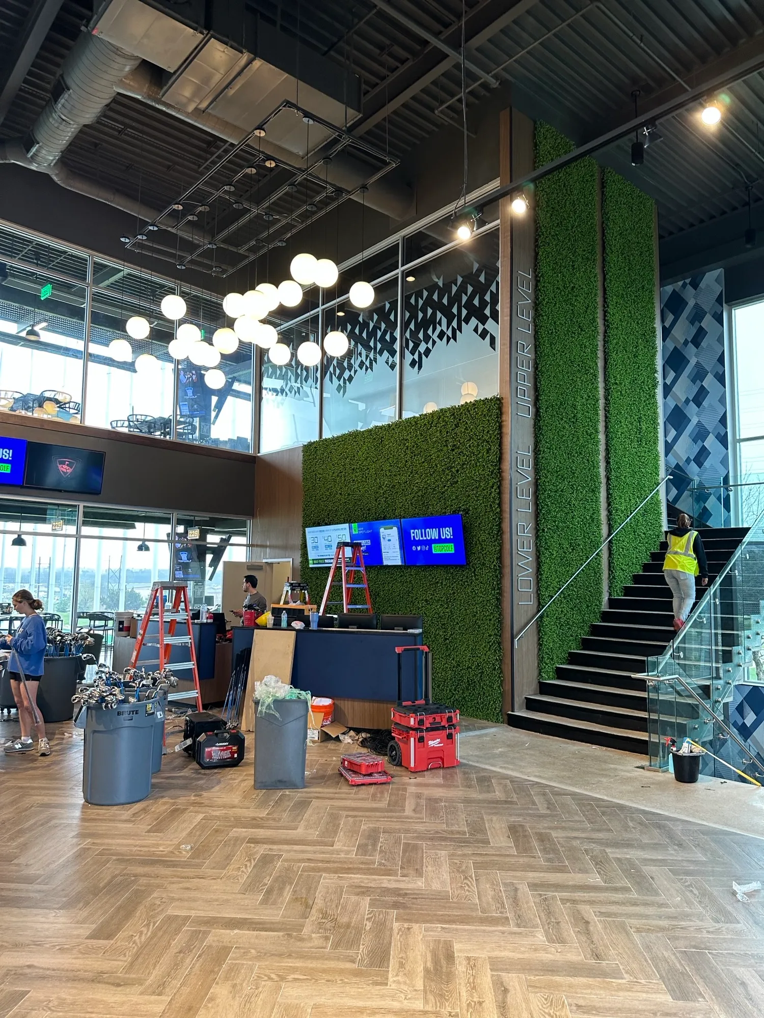 Interior of a commercial space with a 2 story living plant wall