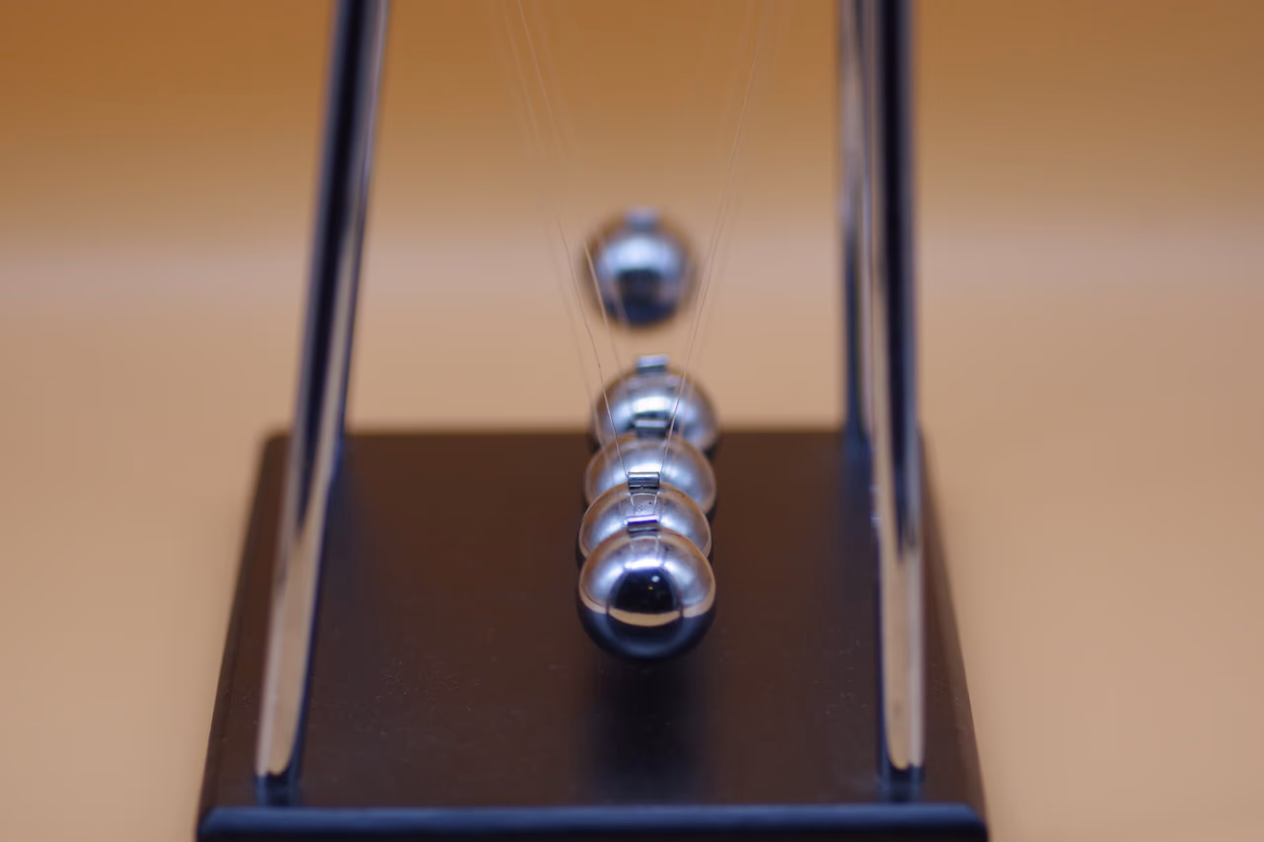 Newton's Cradle also illustrates cause and effect in strategy acceleration.