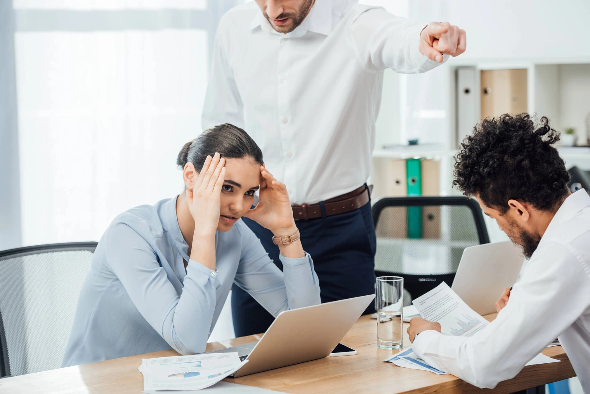 Nearshore employee reviewing benefits and time-off policy on a laptop