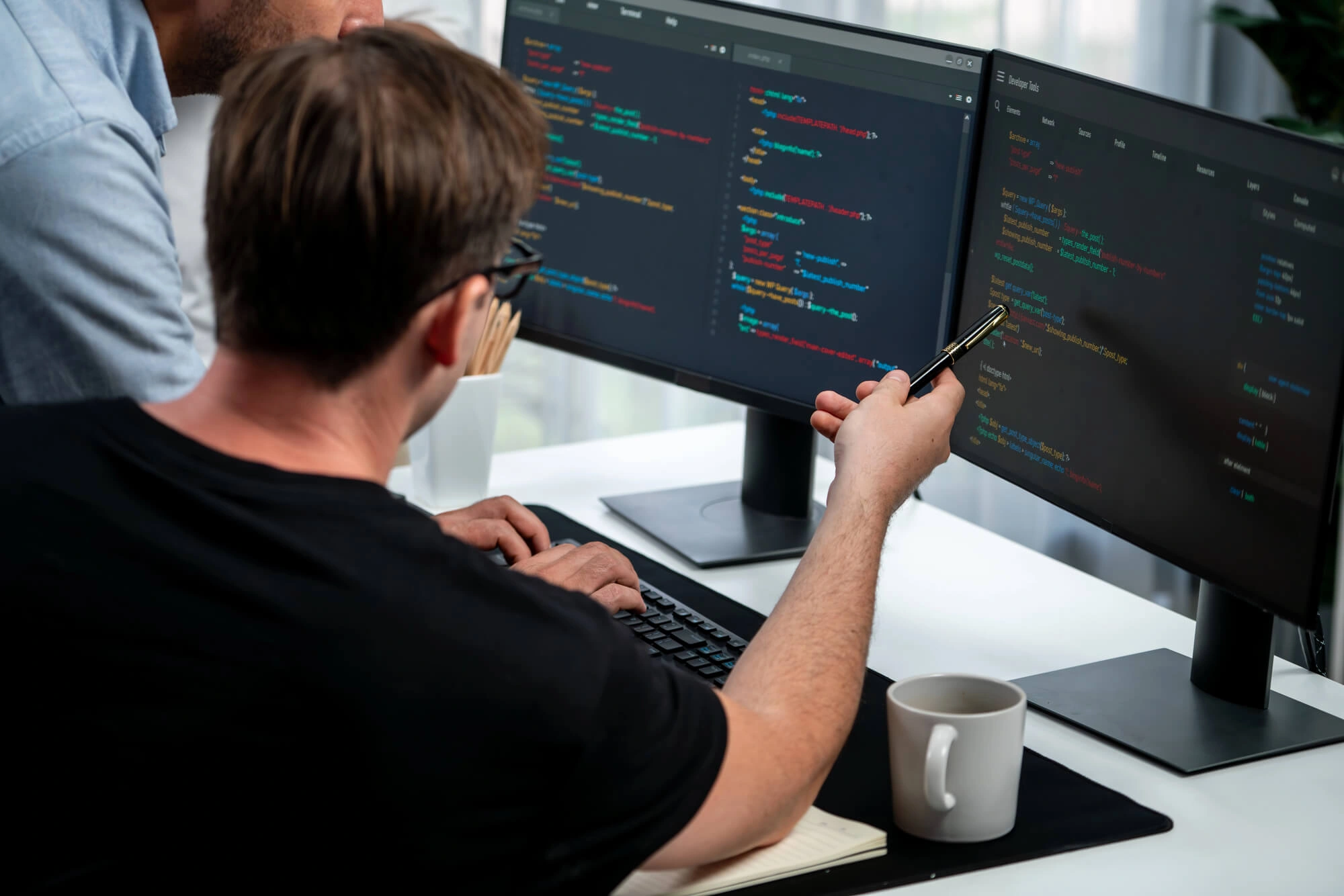 Freelance software developer working on code from a remote home office