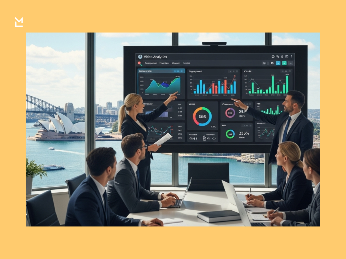 Business meeting in a modern conference room with a digital screen displaying video analytics, as presenters discuss data insights with a team overlooking the Sydney Opera House.