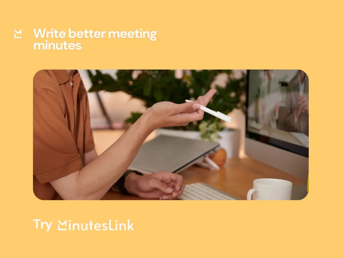 Person writing meeting minutes while attending online meeting and taking notes