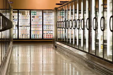 Grocery store aisle with reach-in glass display doors