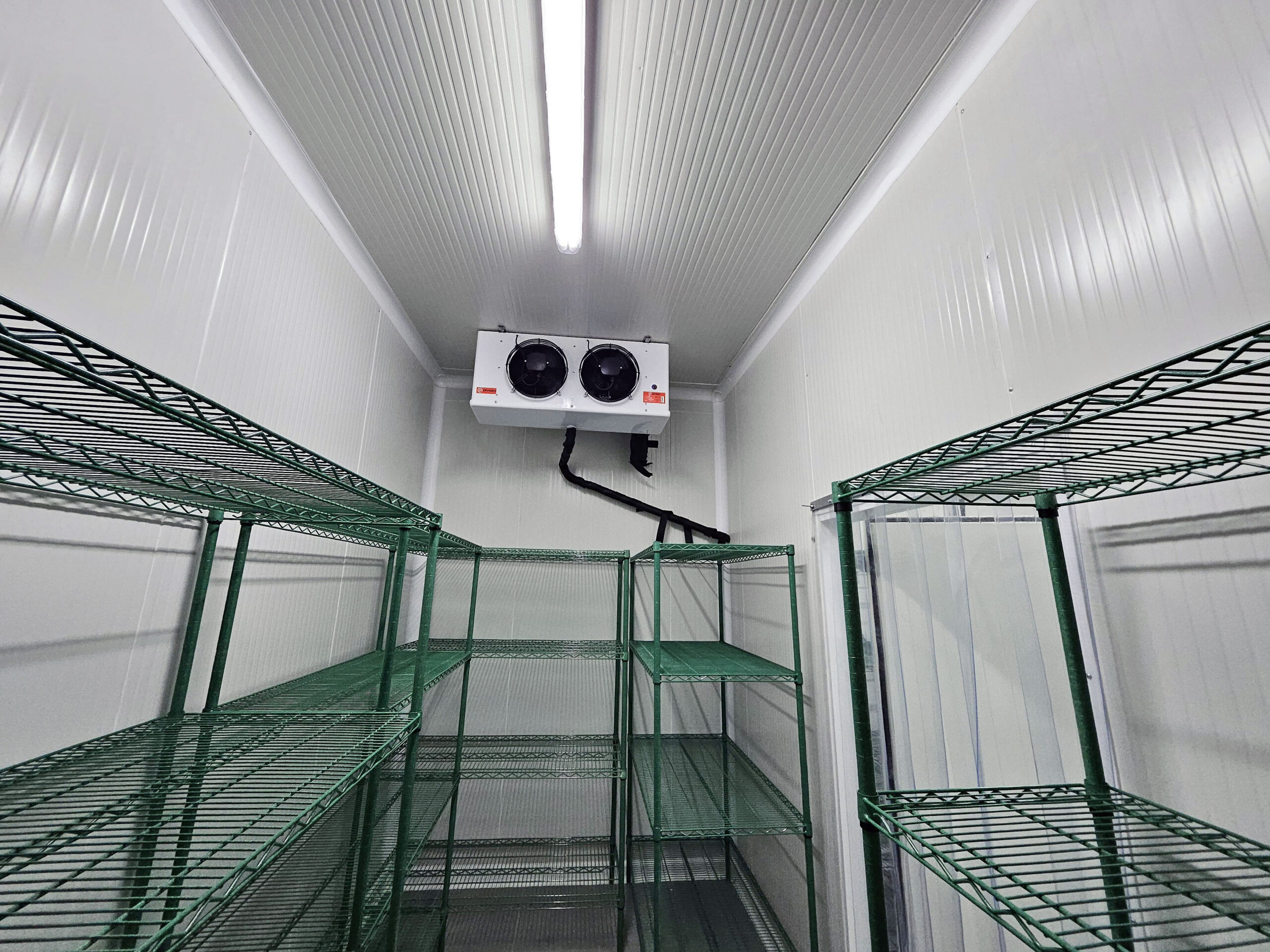 Walk-in cooler interior with CoRound hygienic PVC coving installed