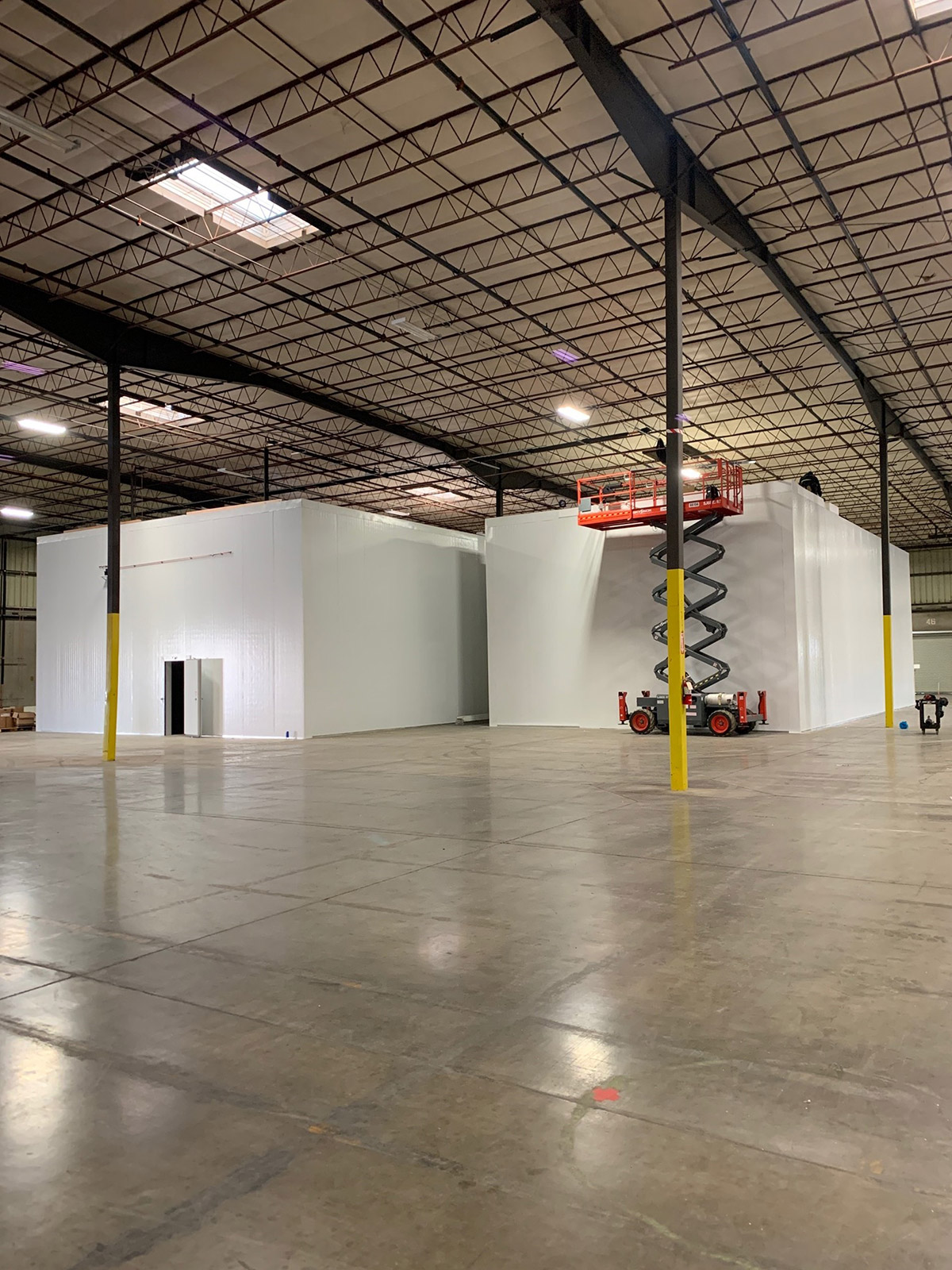 Walk-in cooler interior with shelving and food storage